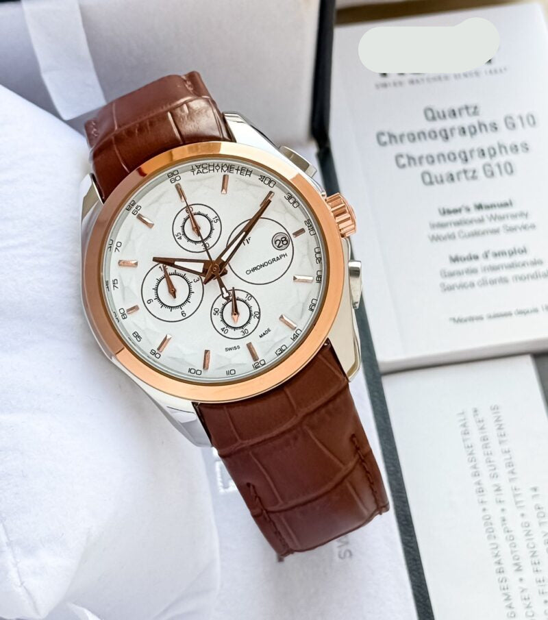 Chronograph watch with brown leather strap, rose-gold case, white dial with subdials.