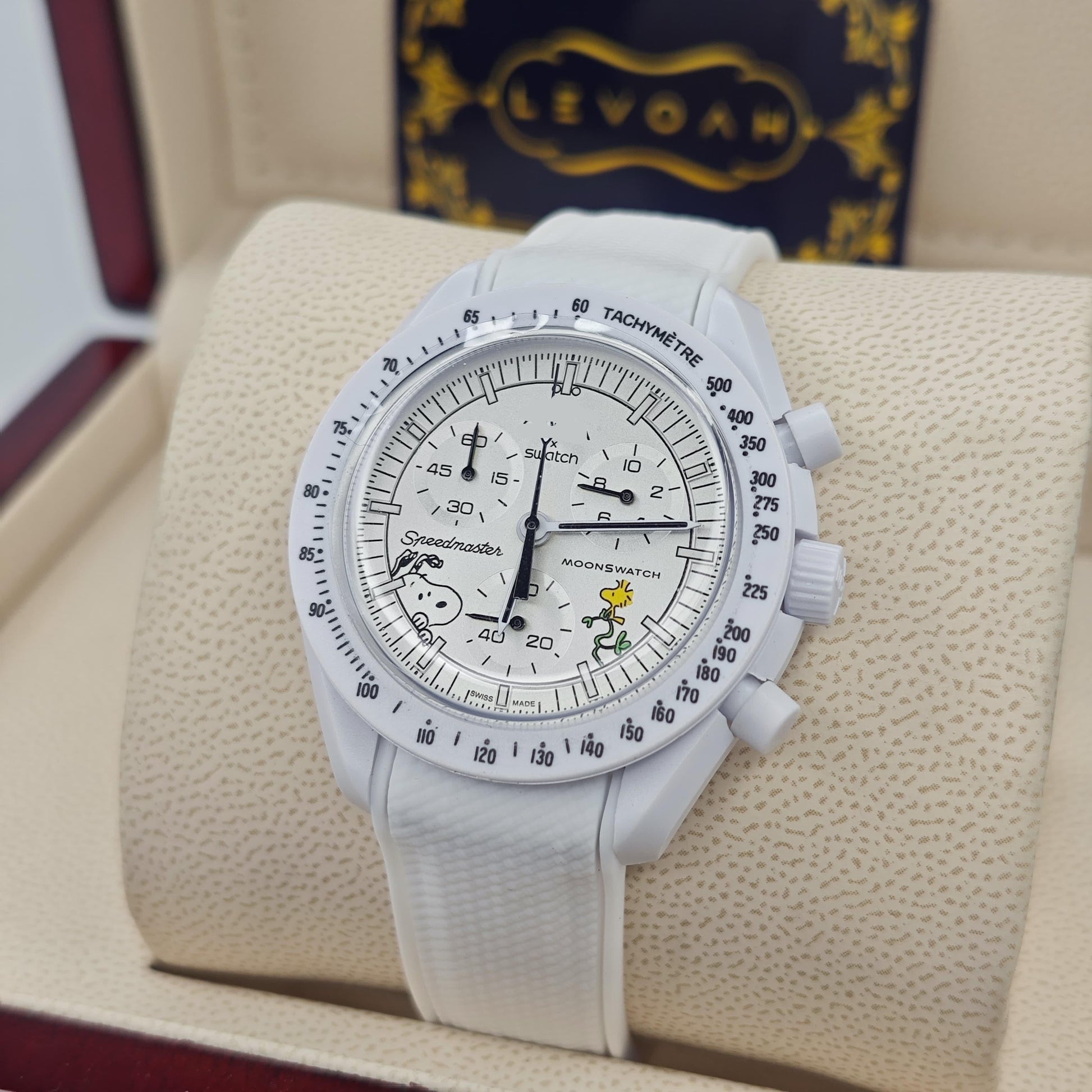 White-dial chronograph wristwatch with white strap and three subdials