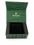 Rolex premium green watch box open showing black velvet cushion interior with Rolex crown logo