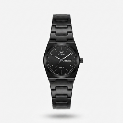A Vokai black stainless steel watch with a black dial, black hands, and a black link bracelet, shown against a light gray background.