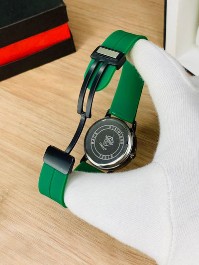 Men's rotating watch on green silicone strap with round black case back detail