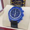 Blue chronograph watch with tachymeter bezel, dark dial, blue strap and subdials