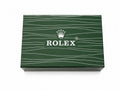 Rolex premium green watch box closed showing signature deep green exterior with white Rolex crown logo
