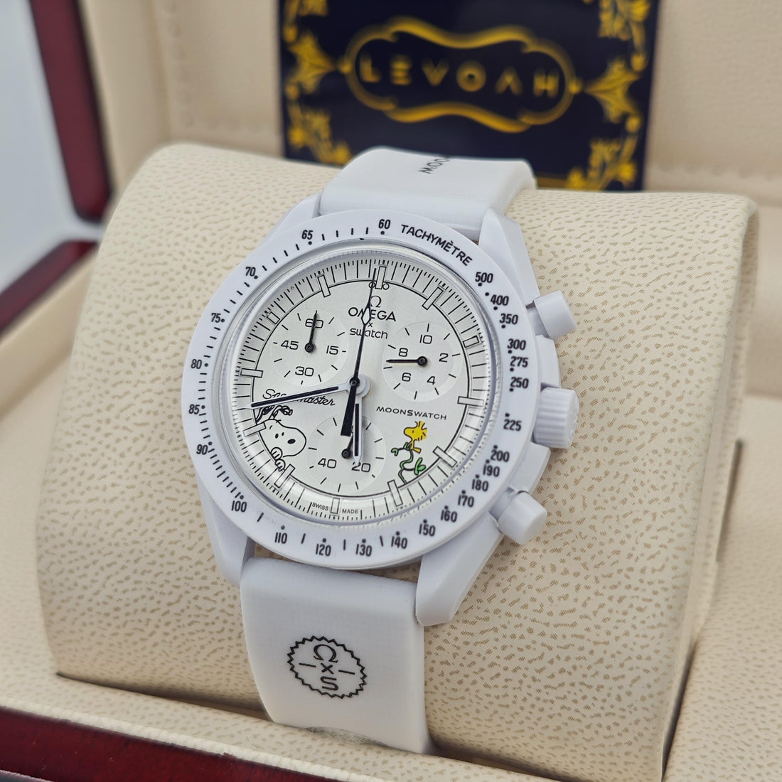 White dial chronograph wristwatch with white strap and date window