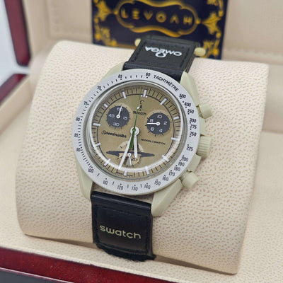 Dark-faced chronograph watch with tachymeter bezel and black strap, moonphase details