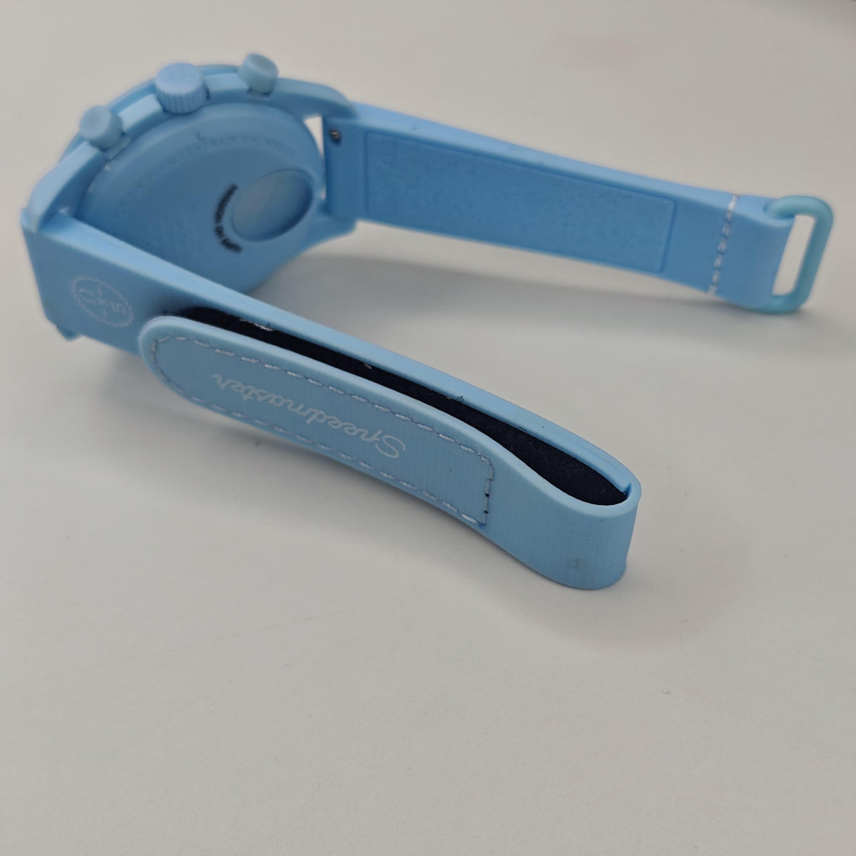 Blue chronograph wristwatch with three pushers on a matching blue strap