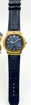Martyn Master Lock men’s watch with gold-tone case, navy leather strap, and blue dial