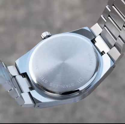 Stainless steel watch case back with engraved text and metal bracelet