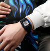 Blue-toned square sport digital watch with LCD display and black textured strap
