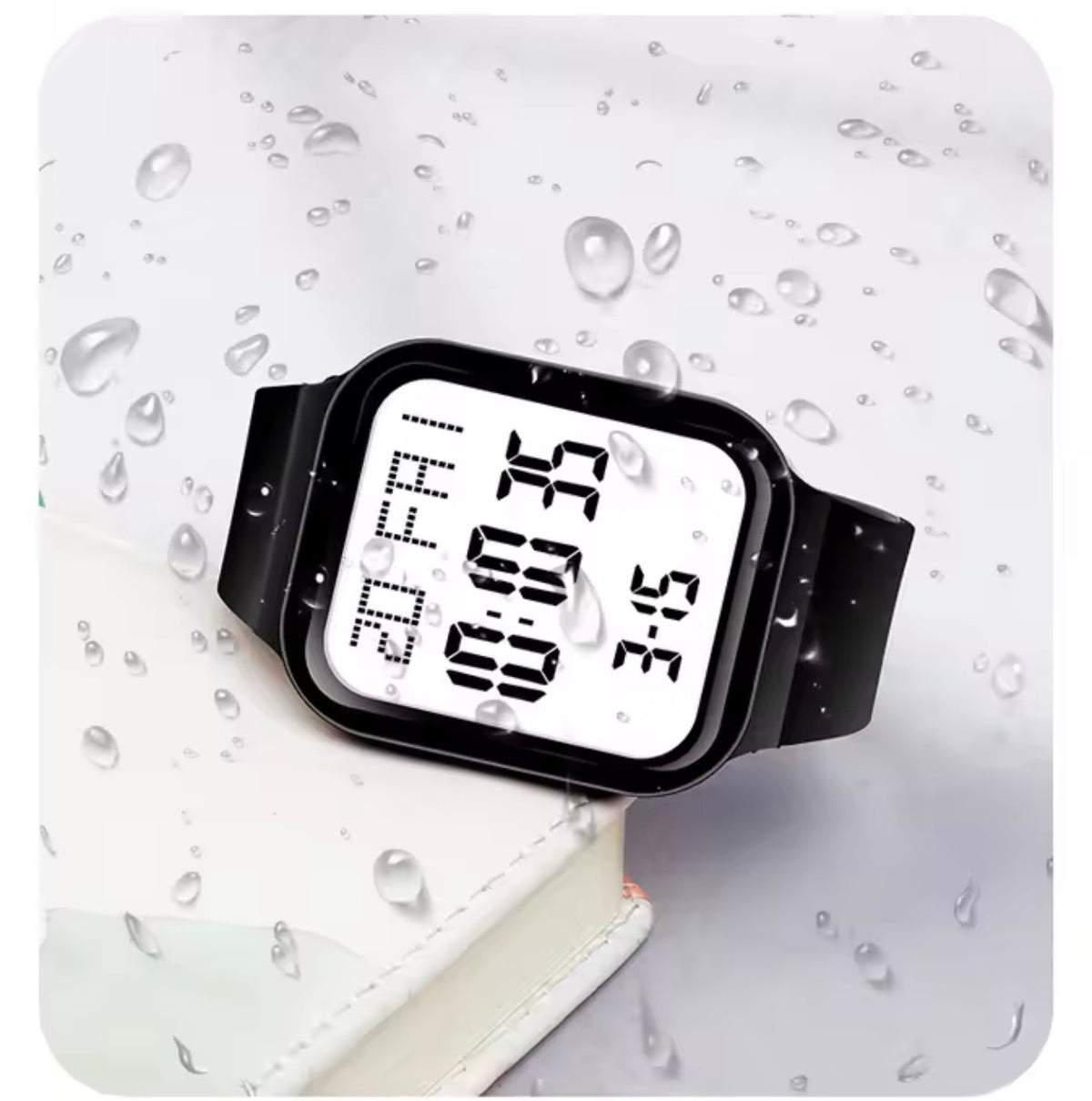 Square digital LED watch with black silicone band and bright white digits display with water droplets
