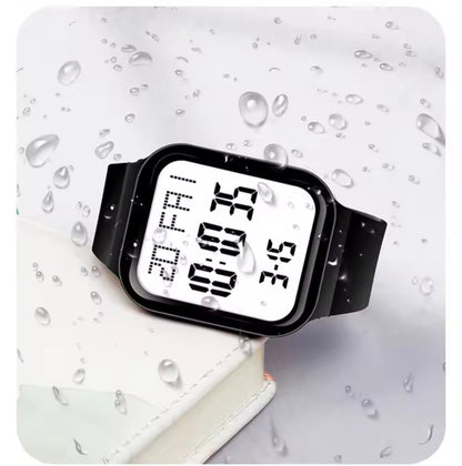 Square digital LED watch with black silicone band and bright white digits display with water droplets