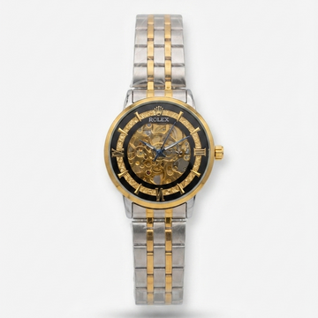 Rolex two-tone steel and gold skeleton watch with a black dial, shown on a light gray background.