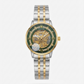 Rolex two-tone skeleton watch with a green dial, gold case details, and a silver-and-gold stainless steel link bracelet, shown on a light gray background.