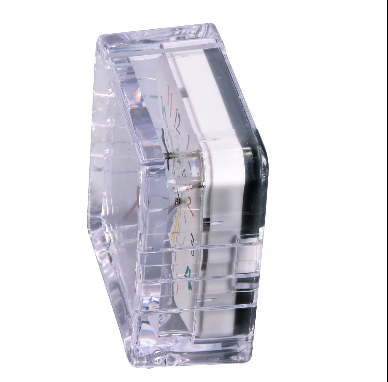Clear compact alarm clock body, angled side view with transparent casing