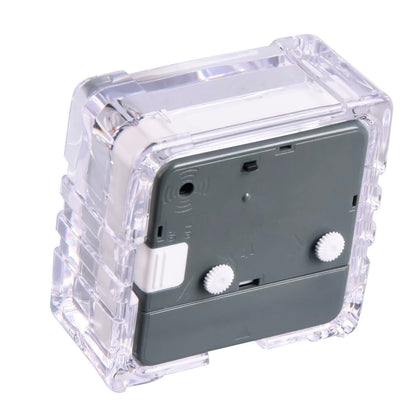 Transparent alarm clock back with battery compartment and adjustment knobs