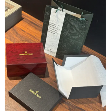 Original Audemars Piguet watch box set with red lacquered wooden box, dark grey document box, warranty certificate and dark green AP shopping bag