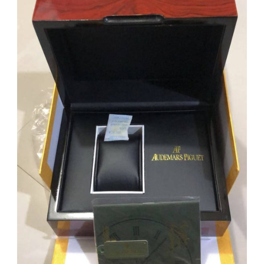 Original Audemars Piguet watch box set with red lacquered wooden box, dark grey document box, warranty certificate and dark green AP shopping bag