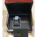Original Audemars Piguet red watch box open showing black velvet interior with AP logo cushion and green warranty card