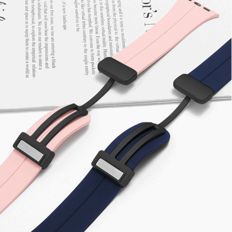 Magnetic quartz watch strap with rectangular metal clasp, shown in pink and dark blue