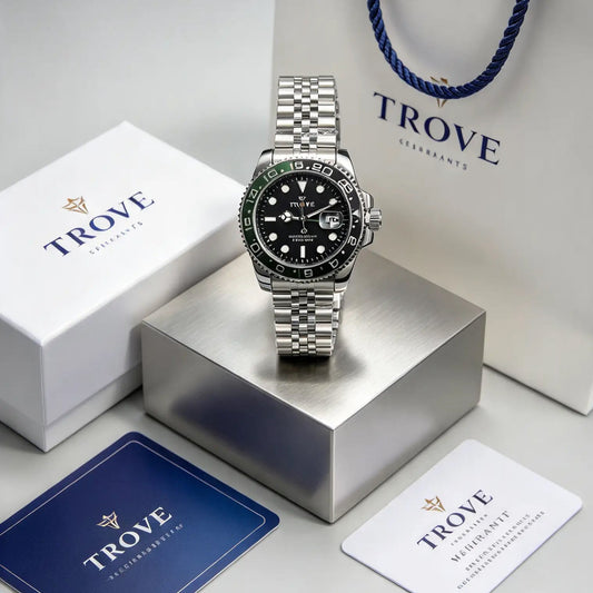 Men's stainless steel watch with black dial, green bezel, on branded gift packaging