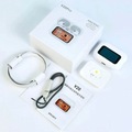 White wireless earbuds with charging case, cables and user cards in packaging